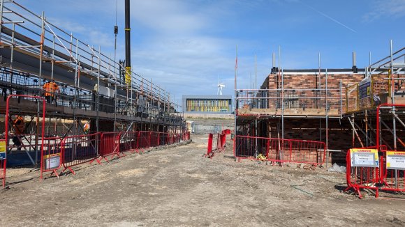 View down the 'street' towards Highfield Spring with the supermarket to the left.